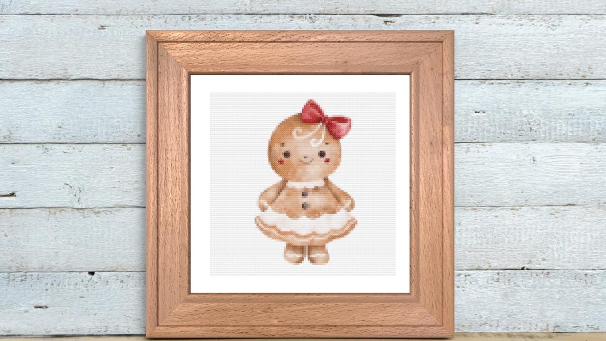 Gingerbread girl with bow cross stitch pattern