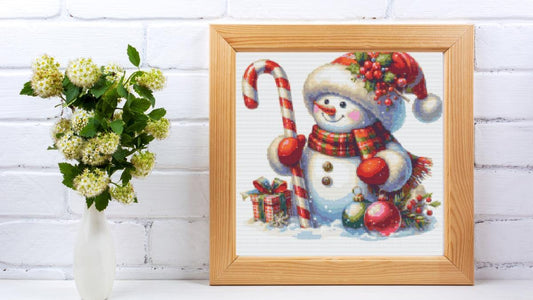 Snowman holding Candy Cane cross stitch pattern